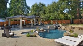 Freeform Pool and Spa with Tanning Ledge, Bubblers and Outdoor Kitchen