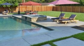 Geometric Pool and Spa with Deck Jets and Tanning Ledge