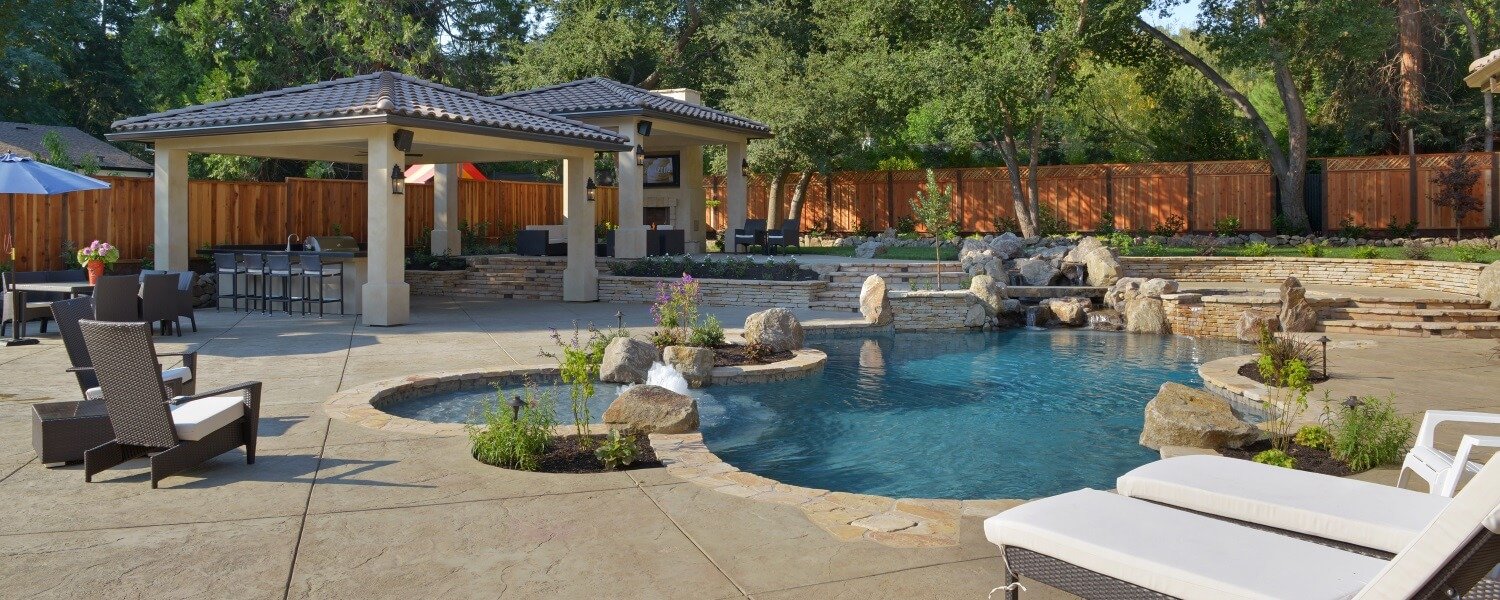Freeform Pool and Spa with Tanning Ledge, Bubblers and Outdoor Kitchen